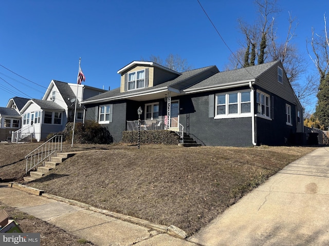 view of front of house with covered porch and stairs