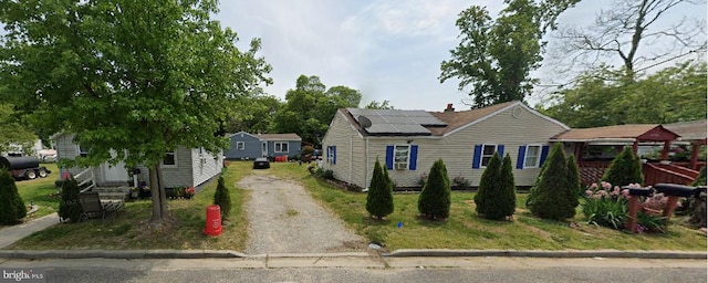 bungalow-style house with solar panels