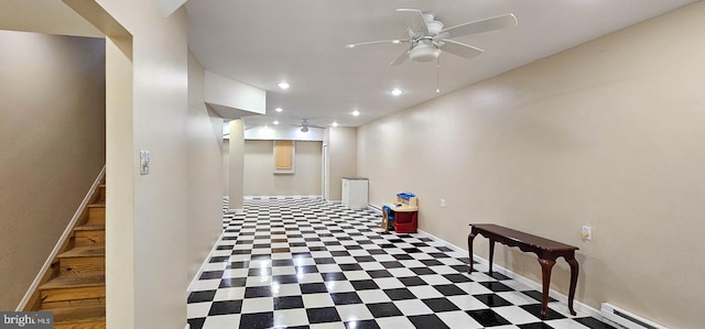 hall with light floors, recessed lighting, a baseboard heating unit, baseboards, and stairs