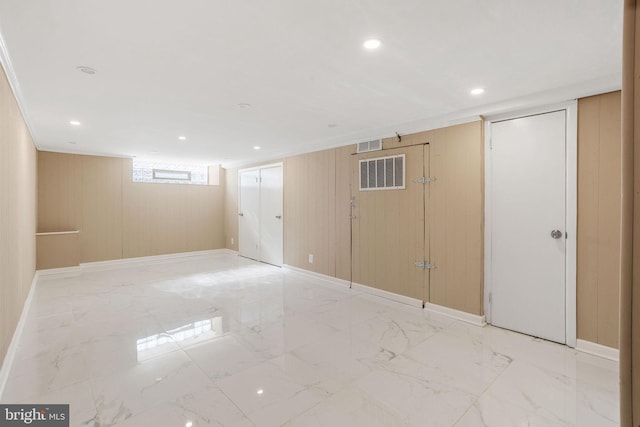 basement with recessed lighting, visible vents, baseboards, and marble finish floor