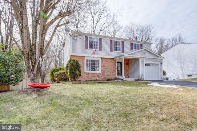 front of property featuring a front yard and a garage