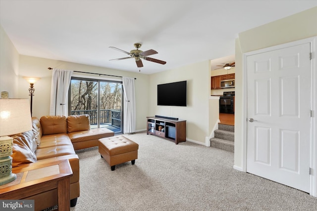 living room with ceiling fan and light carpet