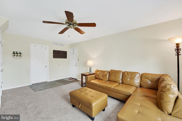 living room with ceiling fan and carpet floors