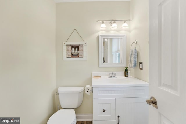 bathroom with toilet and vanity