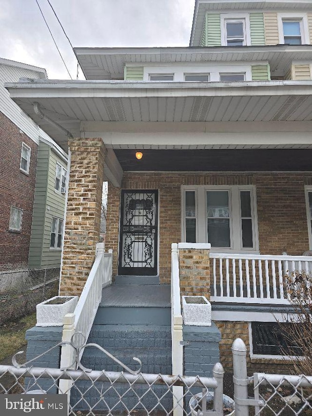 doorway to property featuring a porch