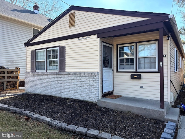 view of front of home with brick siding