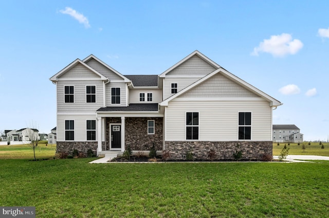 craftsman-style home featuring a front yard