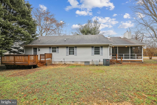 back of house featuring a yard, central AC, a sunroom, and a deck