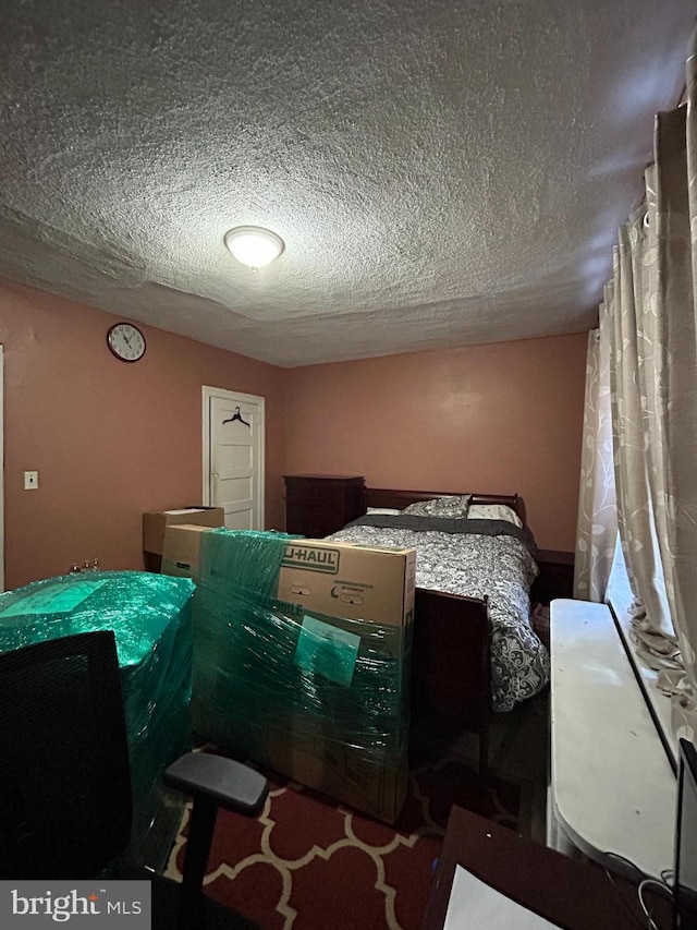 bedroom featuring a textured ceiling