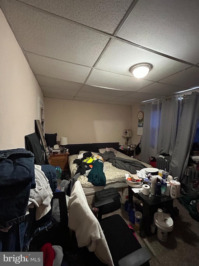 bedroom featuring a drop ceiling