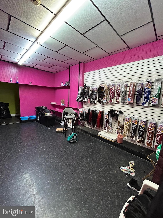 workout area featuring a drop ceiling