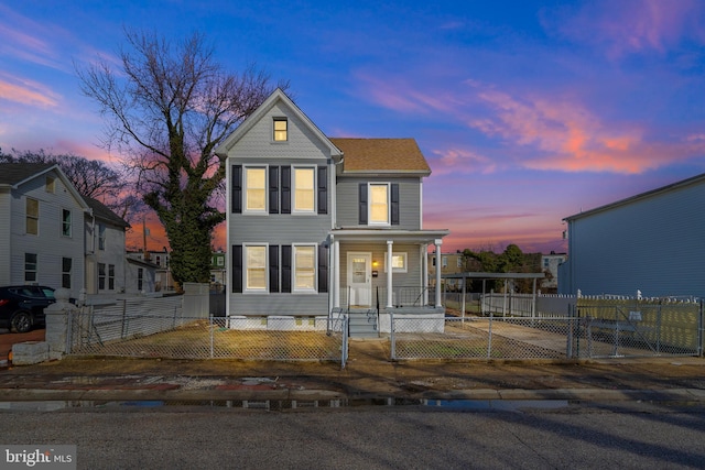 5309 Ethelbert Ave, Baltimore, MD 21215 - view of front of house with a gate, a porch, and a fenced front yard