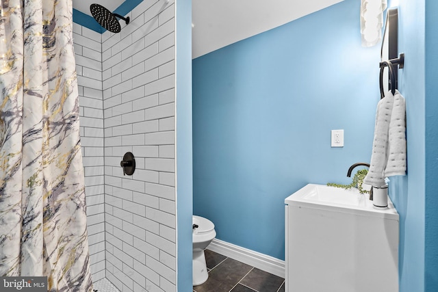 bathroom featuring toilet, sink, tile patterned flooring, and a shower with shower curtain