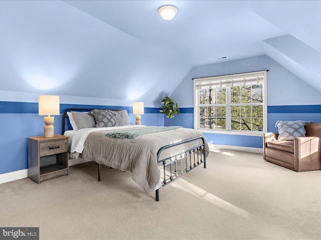 bedroom featuring vaulted ceiling, carpet flooring, and baseboards