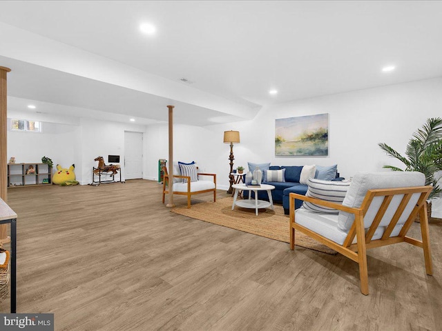 living area featuring recessed lighting and light wood-style flooring