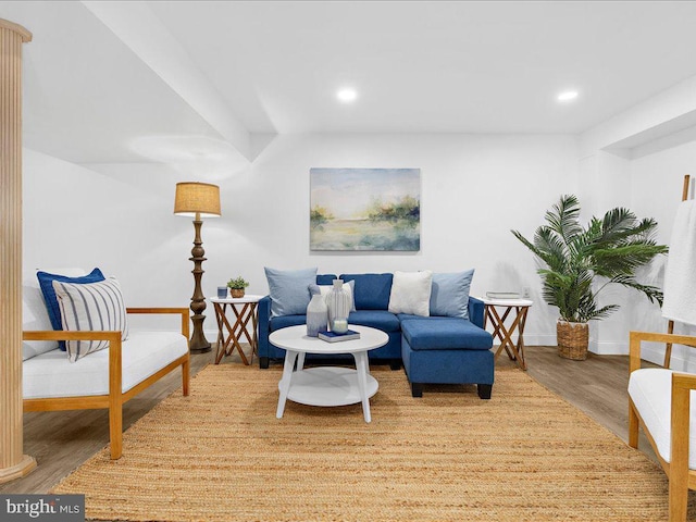 sitting room with recessed lighting, baseboards, and wood finished floors