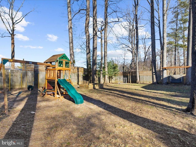 view of jungle gym featuring fence