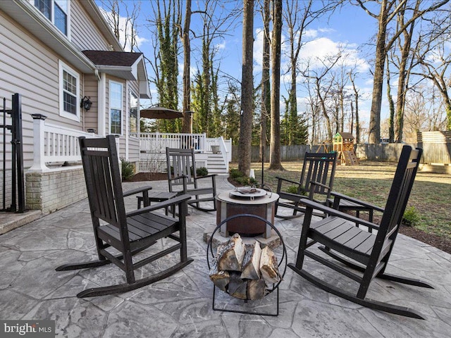 view of patio / terrace featuring a playground and a fenced backyard