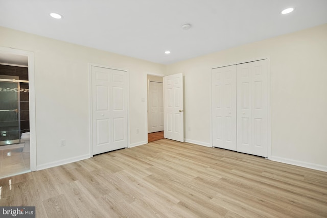 unfurnished bedroom featuring wood finished floors and recessed lighting