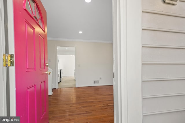 entrance foyer featuring recessed lighting, wood finished floors, visible vents, baseboards, and ornamental molding