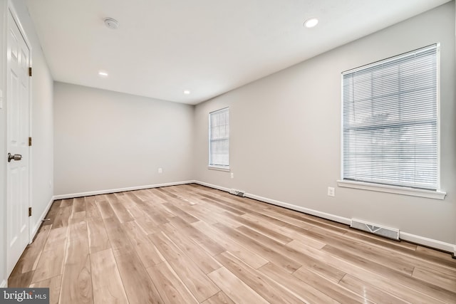 spare room with light hardwood / wood-style flooring