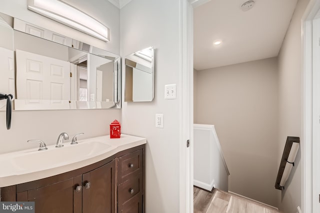 bathroom with hardwood / wood-style flooring and vanity