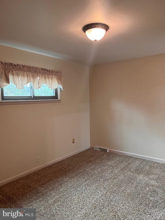 view of carpeted spare room