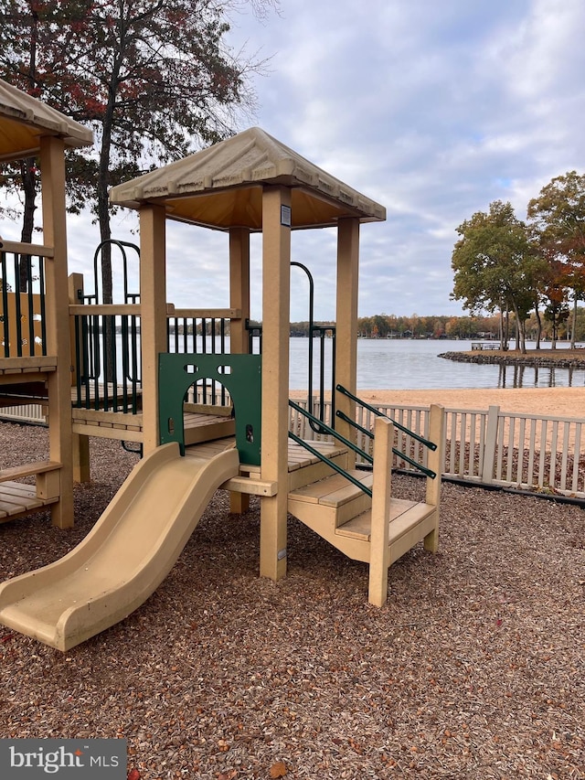 view of jungle gym with a water view