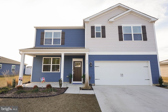 view of property featuring a garage and covered porch