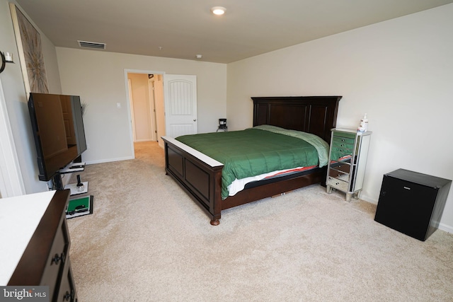 bedroom with light colored carpet