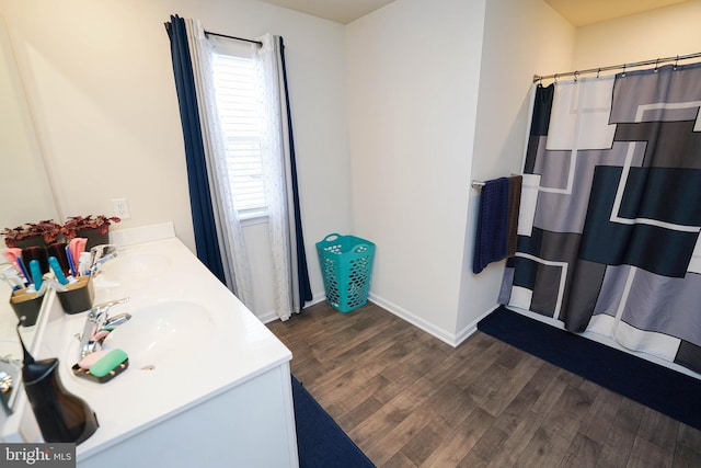 bathroom featuring hardwood / wood-style flooring, vanity, and a shower with curtain