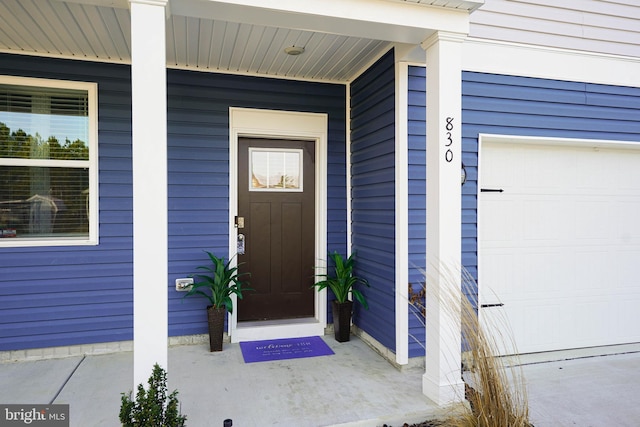 doorway to property featuring a garage