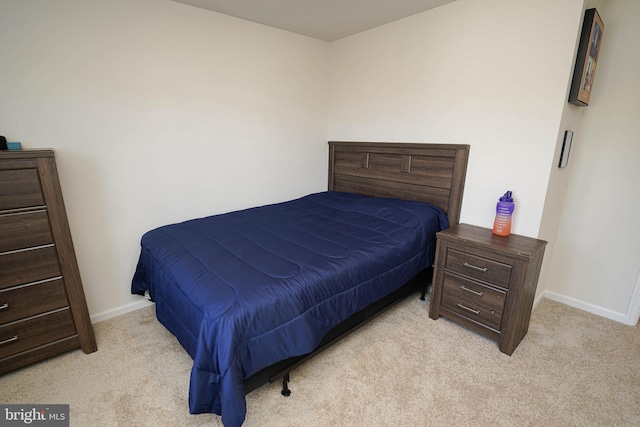 bedroom with light colored carpet