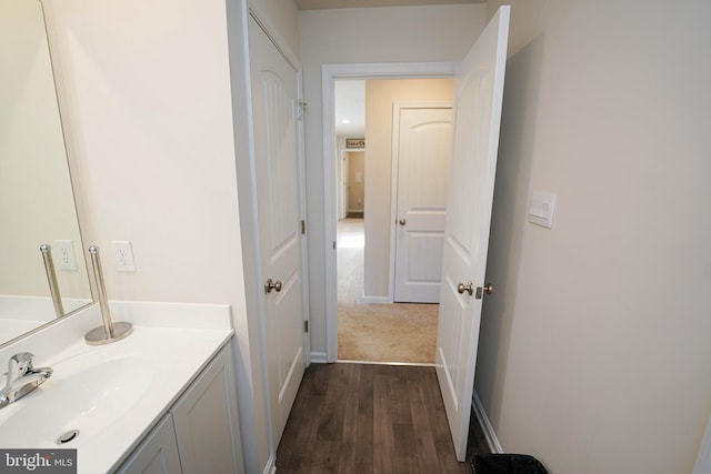 bathroom with vanity and hardwood / wood-style flooring