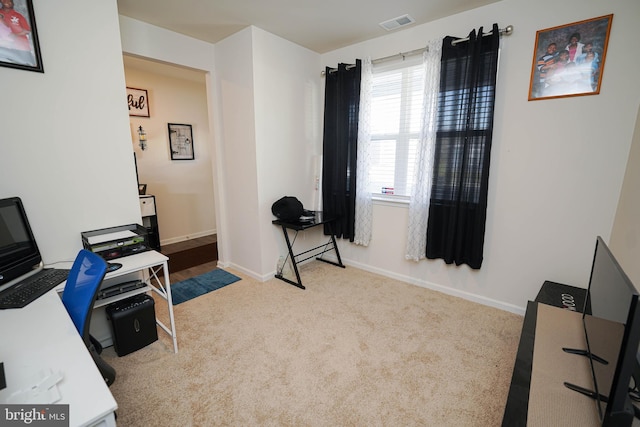 home office with light colored carpet