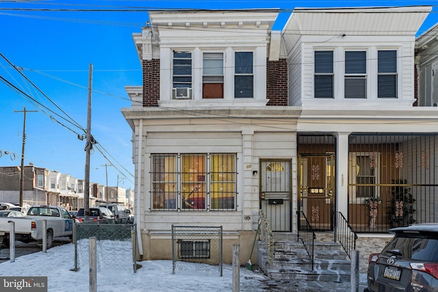 view of front of property featuring cooling unit