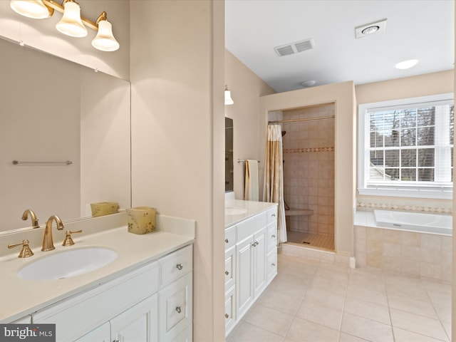 bathroom with visible vents, tile patterned floors, a sink, a shower stall, and a bath