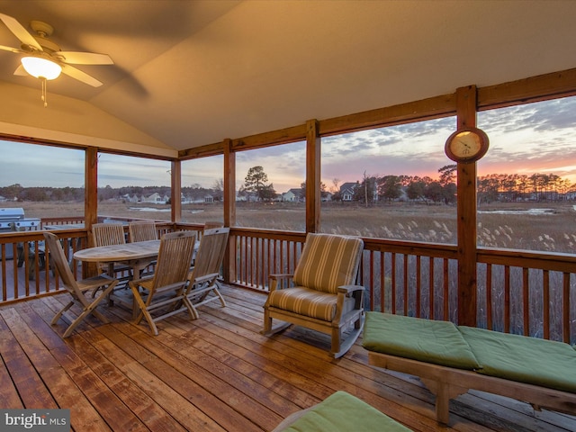 sunroom featuring vaulted ceiling and a ceiling fan