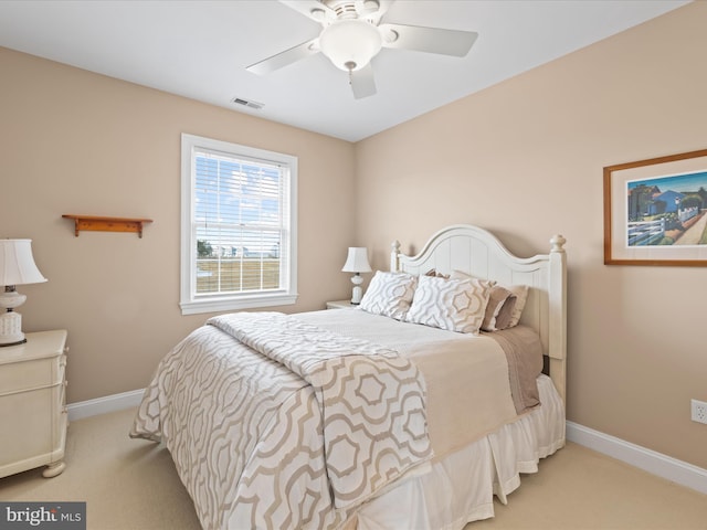 bedroom with a ceiling fan, visible vents, light carpet, and baseboards