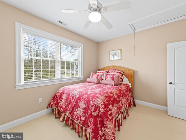 bedroom featuring carpet floors, attic access, visible vents, and baseboards