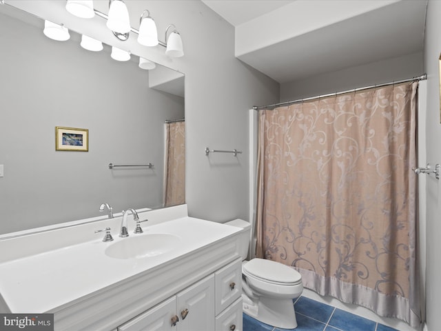 full bathroom with a shower with shower curtain, vanity, toilet, and tile patterned floors