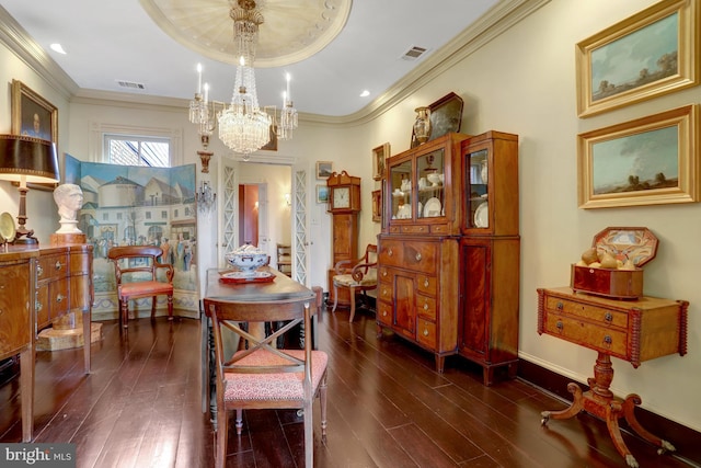 dining space featuring visible vents, dark wood-type flooring, and ornamental molding