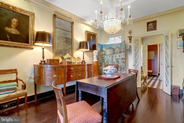 dining room featuring baseboards, dark wood finished floors, and ornamental molding