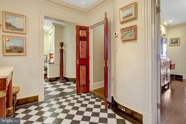 corridor featuring baseboards, dark floors, and crown molding