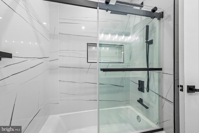 full bathroom featuring shower / bath combination with glass door