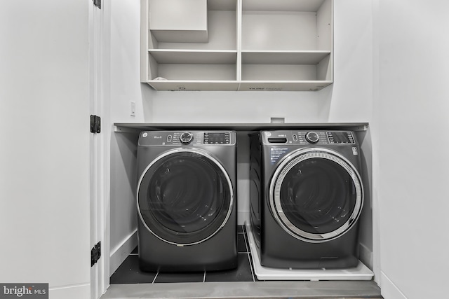 clothes washing area featuring laundry area and independent washer and dryer