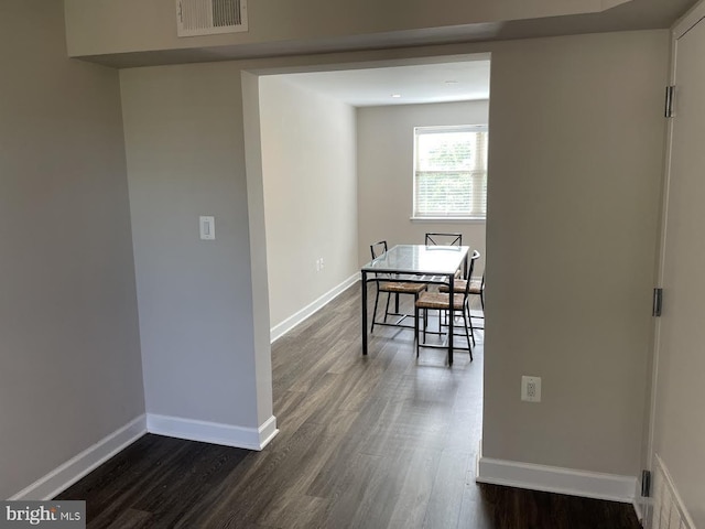 dining space featuring dark hardwood / wood-style floors