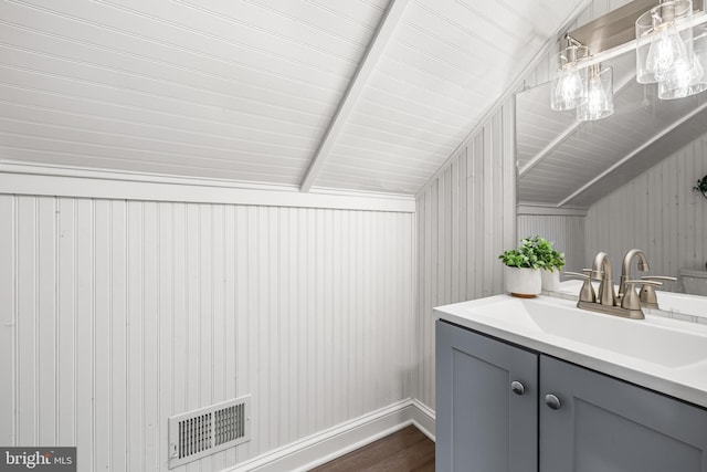 bathroom featuring vanity and wood-type flooring