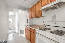 kitchen featuring white range with gas cooktop and sink