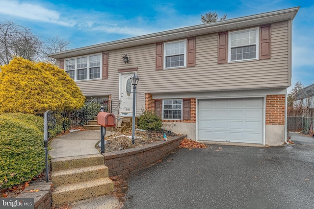 split foyer home featuring a garage